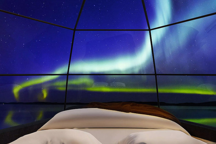 glass igloo looking at the northern lights