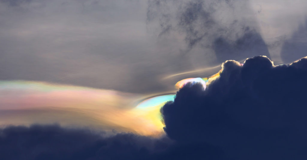 Stunning Iridescent Clouds Captured In Rare Sighting on Siberian Peak - Featured image