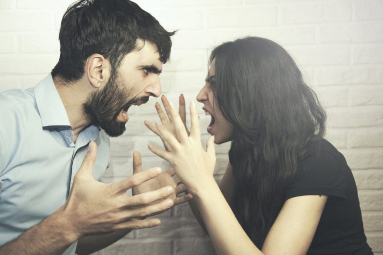 man and woman yelling at one another