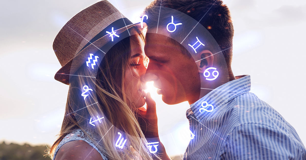 a couple kissing with circular image of all the zodiac signs imposed over top