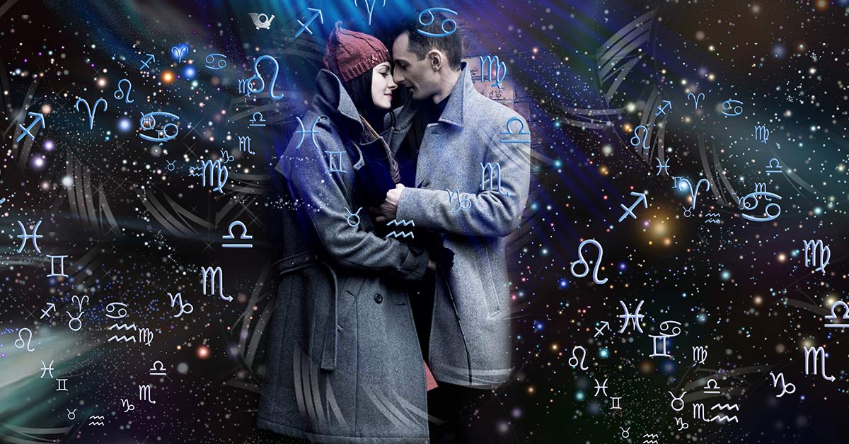 couple closely embracing surrounded by zodiac signs