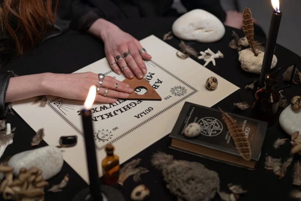 Woman's hands on ouija board