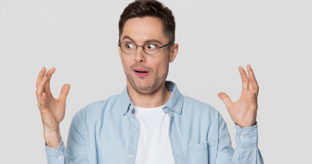 amazed confused guy with narcissism in glasses bragging with large big size exaggerating gesture