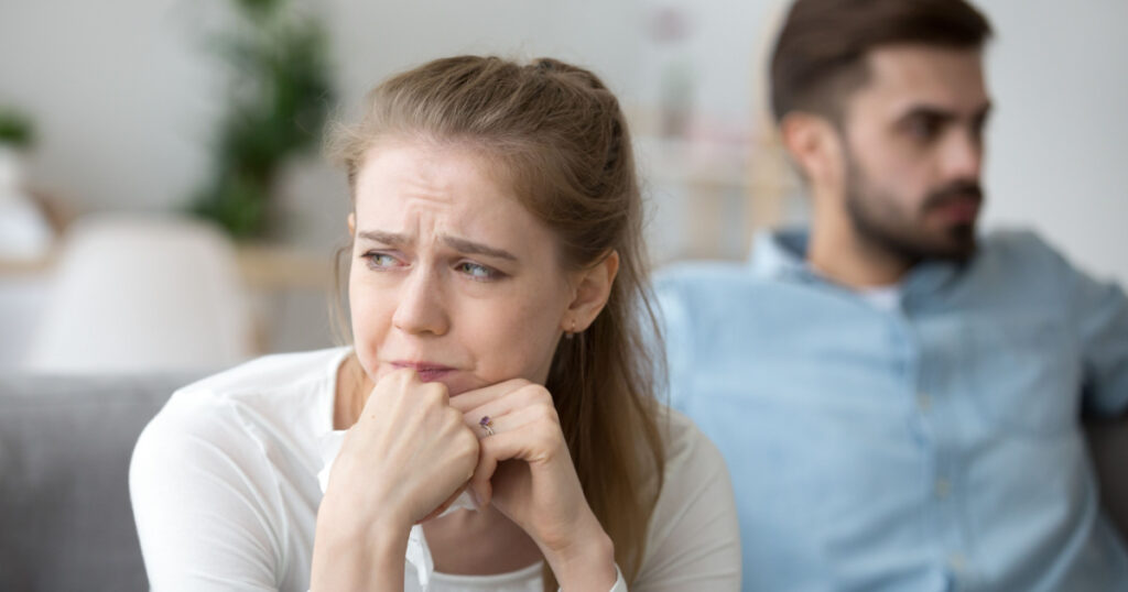 Close up of sad woman cry after fight with husband, unhappy young wife feel lonely having disagreement with spouse, upset female look in distance thinking of relationships problems or breakup
