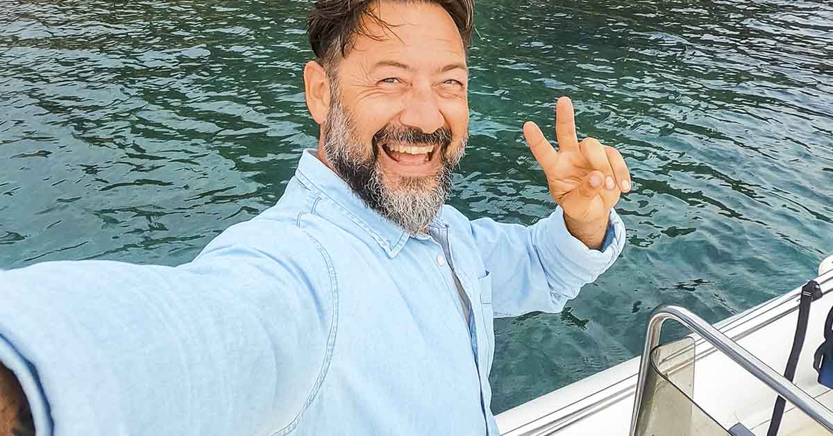 man taking selfie on boat