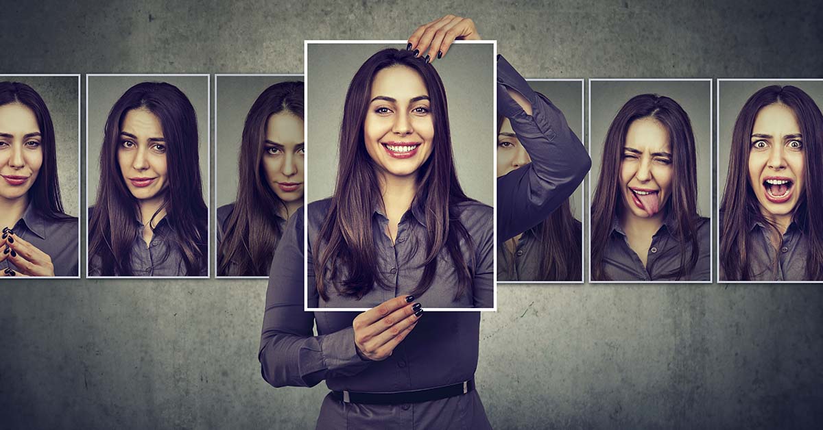 woman holding up various images of her. Psychology concept, various personalities