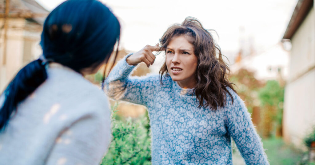 Two young women argue