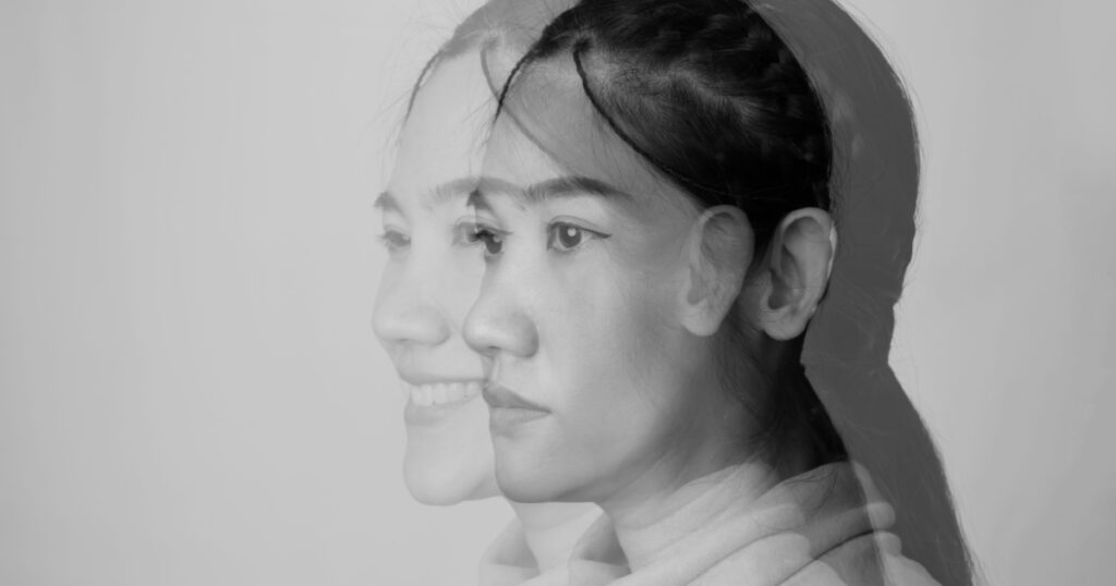 Double exposure of close-up of asian beautiful woman who internally suffering from dissociative identity disorder. Bipolar and Depression woman.
