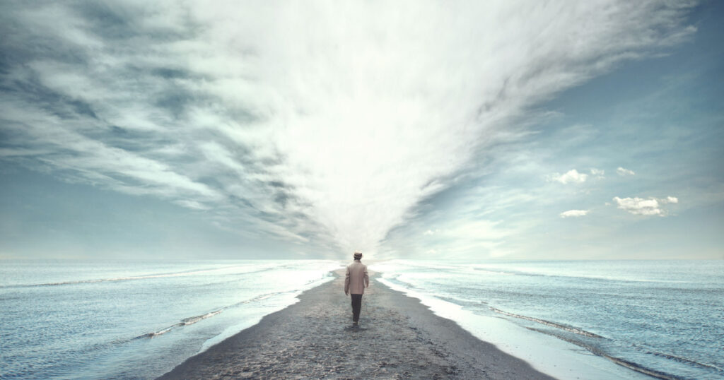 man walking between two seas
