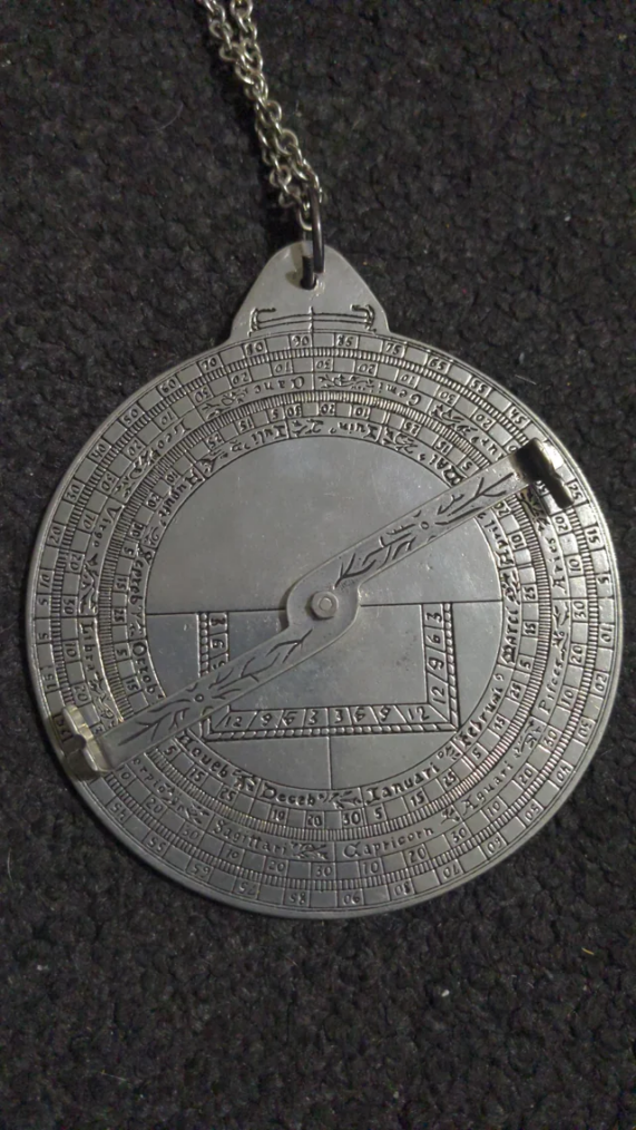 Metallic compass-like object