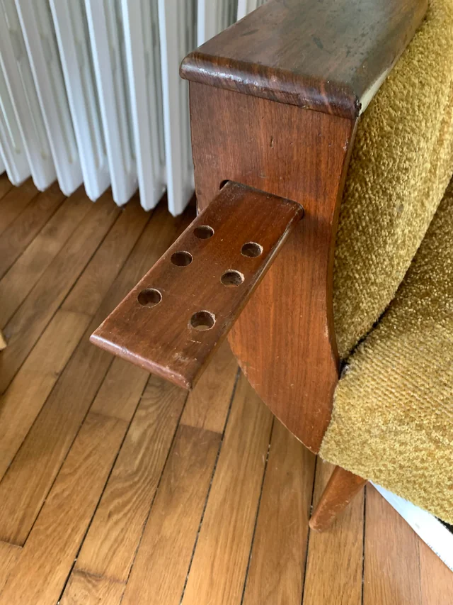 Vintage sofa with holes on side trays