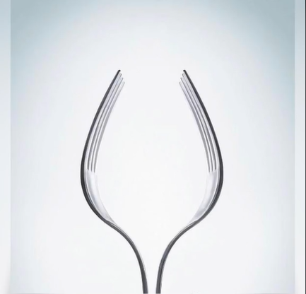 two forks, that resemble a shape od a wine glass 