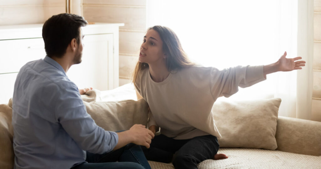 ngry worried young spouses quarreling arguing at home