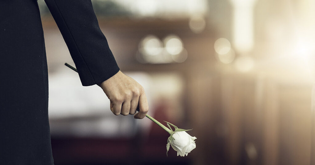 At Her Husband’s Funeral, Woman Leans In To Say Goodbye And Notices He’s Blinking – a Short Story - Featured image