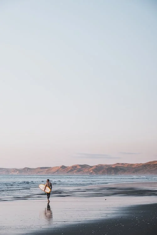 Man Standing on Sea Shore
