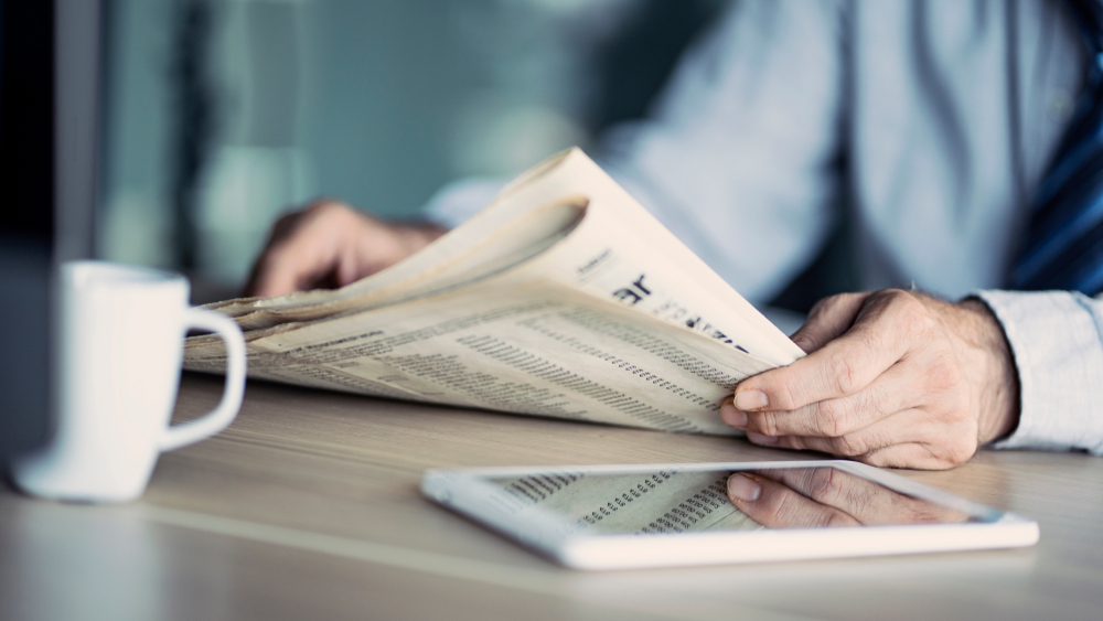 man reading newspaper