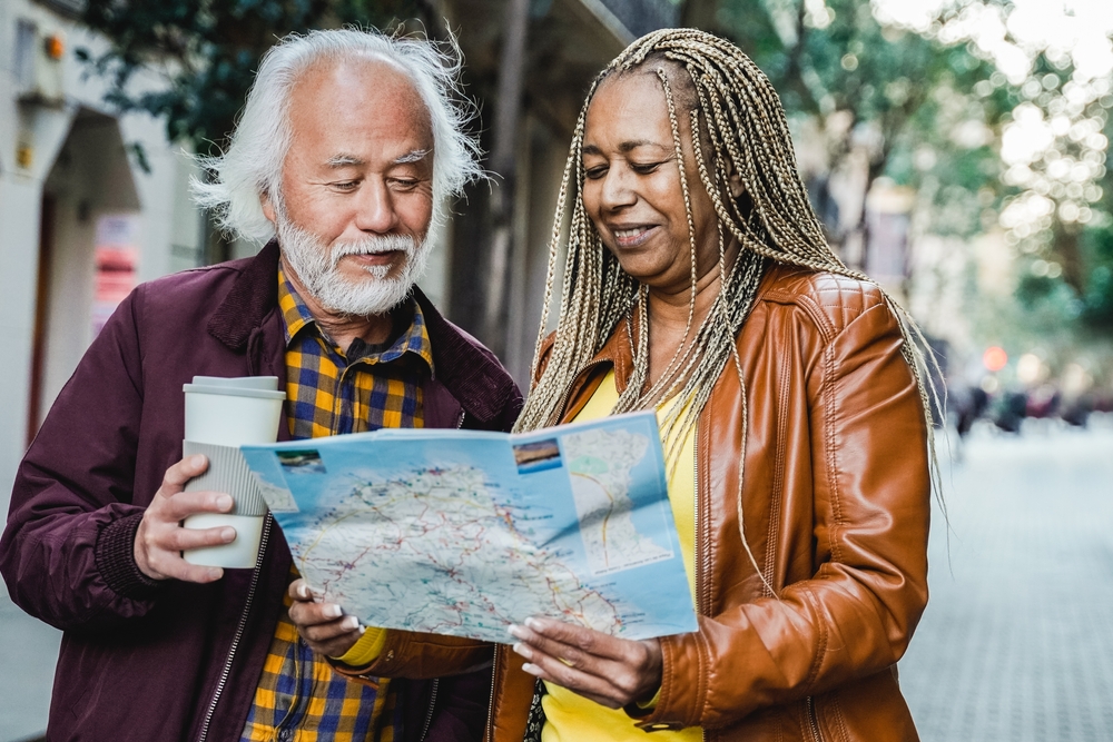 senior couple looking at map