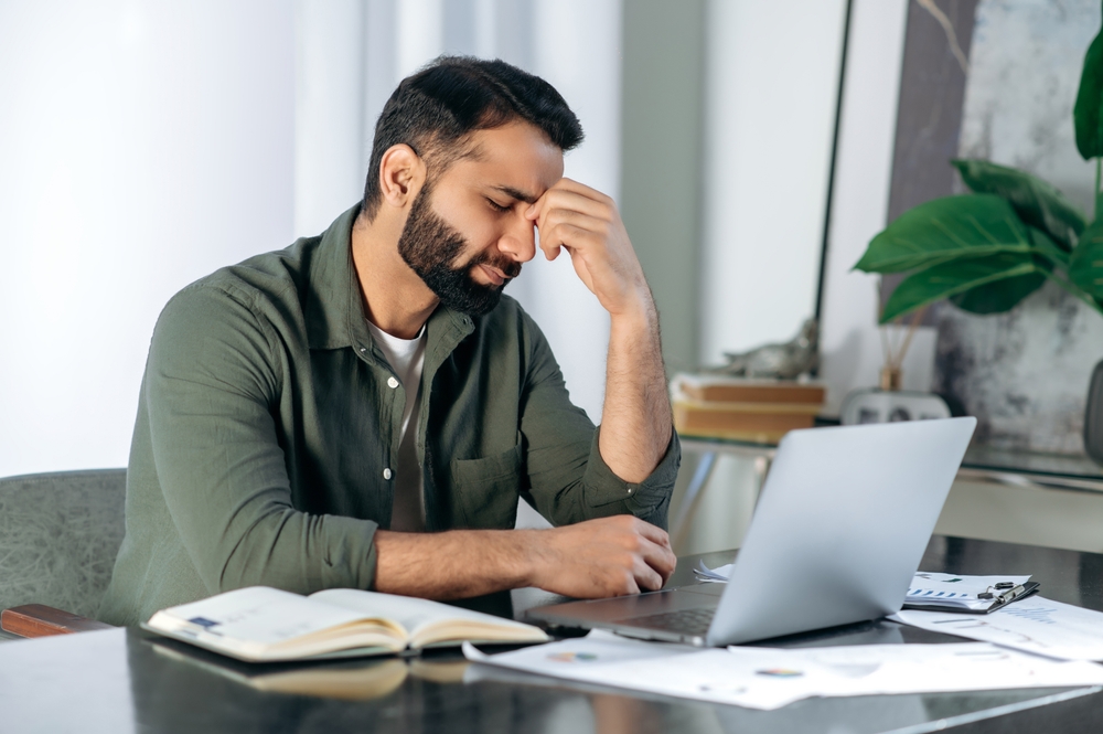 man exhausted at office