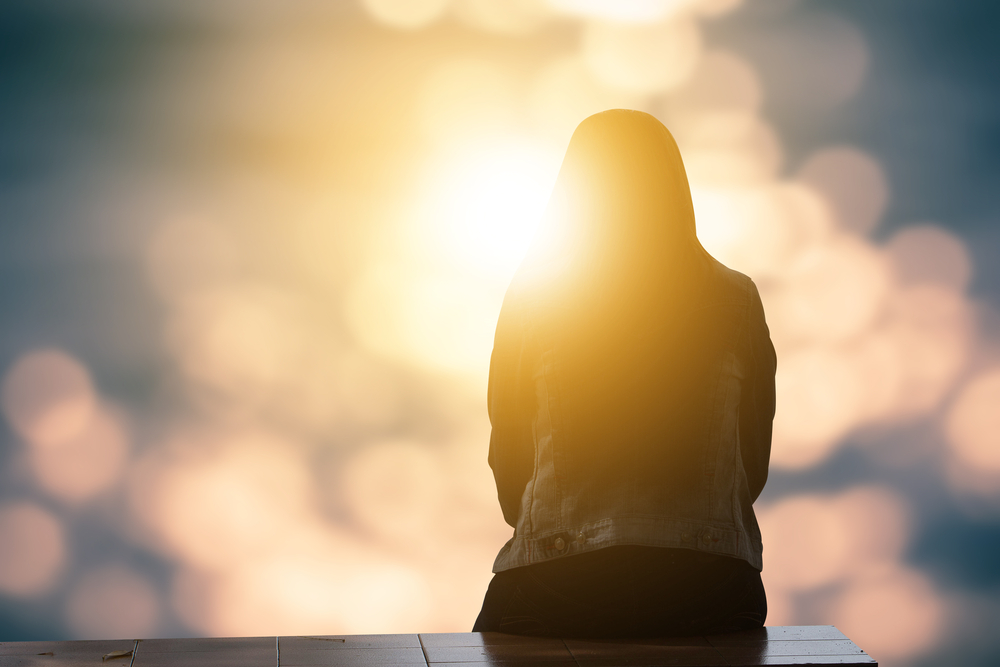 woman sitting in light