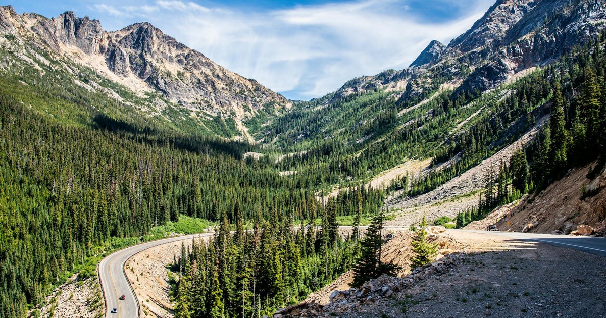 Breathtaking view of a winding highway through the Cascade Mountains in Washington, USA.