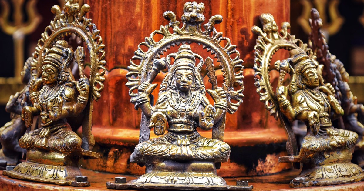 Close-up of bronze Hindu goddess statues with detailed craftsmanship in Anachal, Kerala.