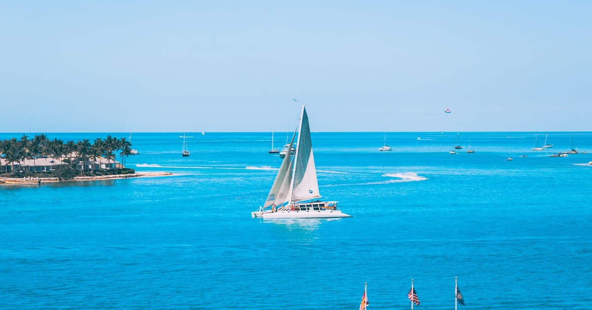 A picturesque sailboat gliding through the turquoise waters of Key West, Florida.