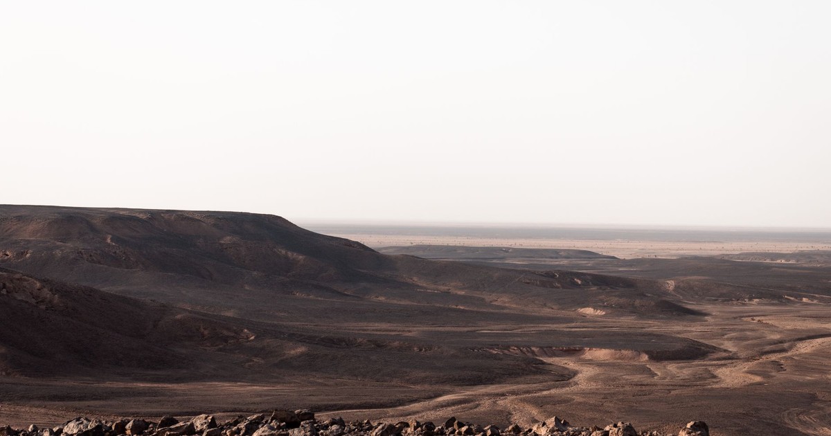 Panoramic view of Timokten's rocky desert terrain in Algeria's Adrar Province.