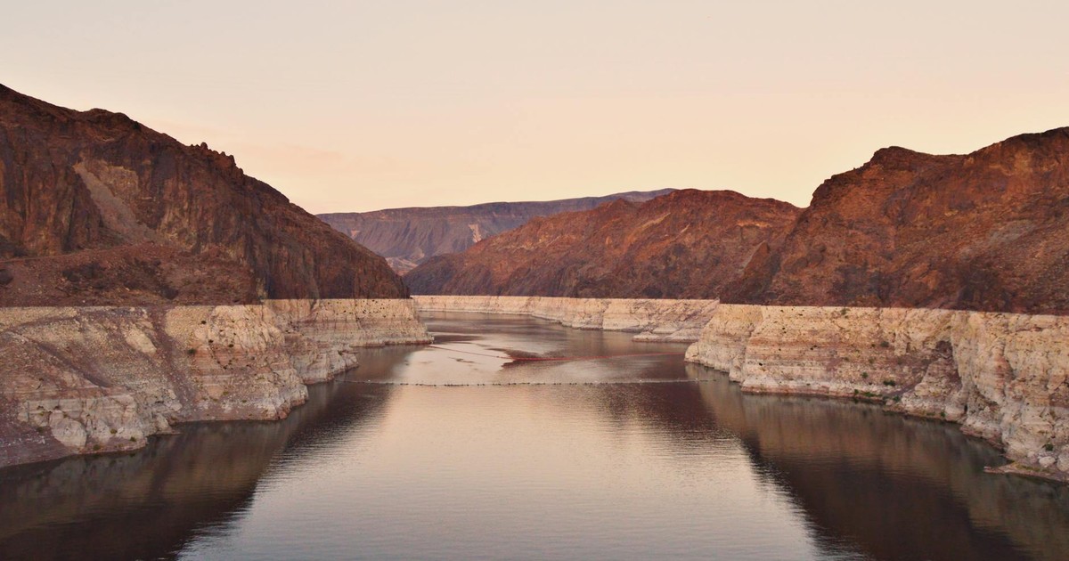 A stunning view of Lake Mead at sunset, showcasing the rocky desert landscape in Boulder City, Nevada.