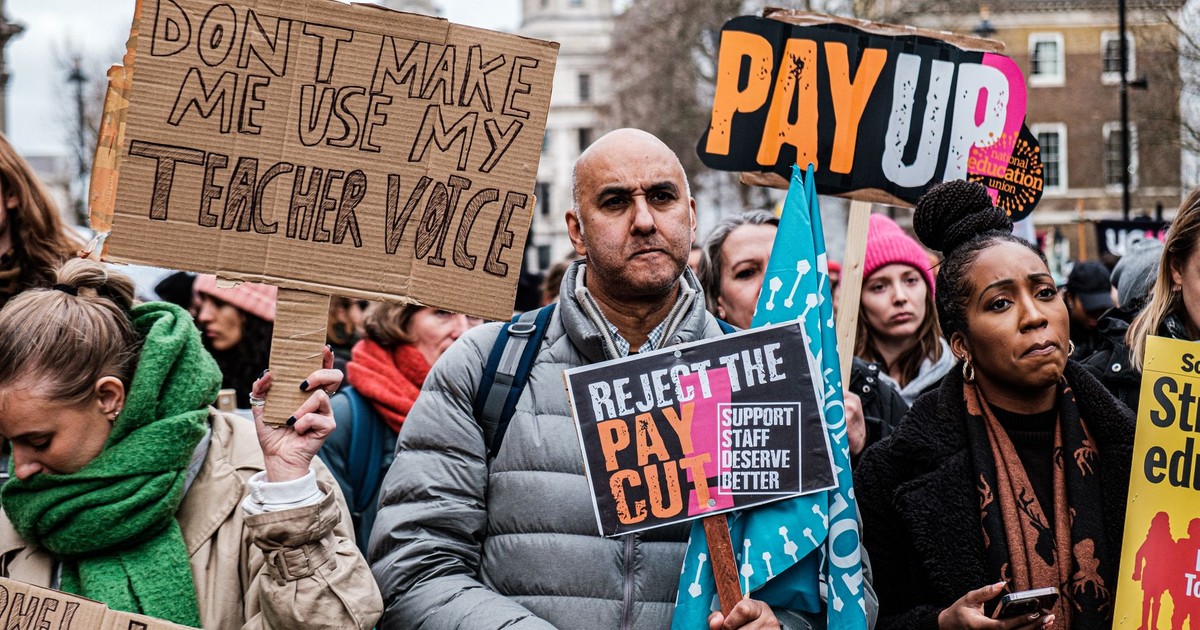 Teachers join a protest in London demanding fair pay and better conditions.
