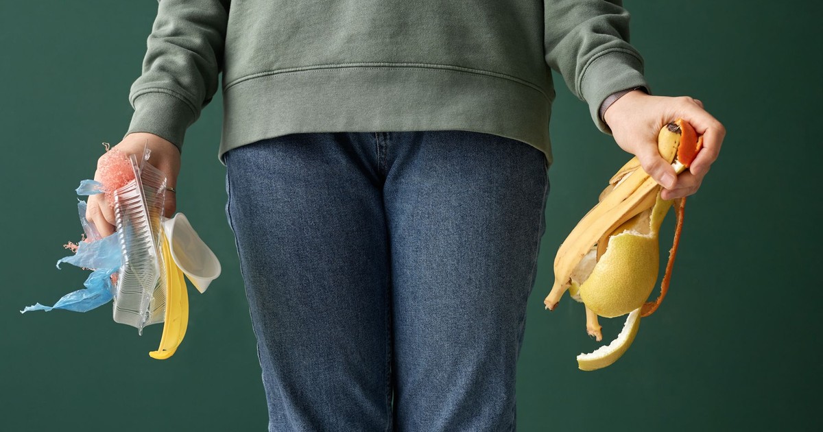 An adult holding organic waste and plastic, highlighting recycling and sustainability.