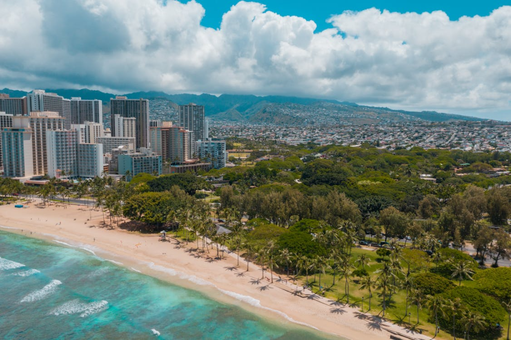Stunning aerial view of Waikiki Beach with the skyscrapers of Honolulu in the backdrop