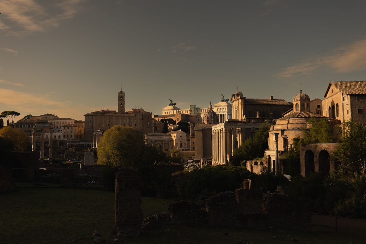 Captivating sunset view of historic Roman buildings, capturing ancient charm and architectural beauty