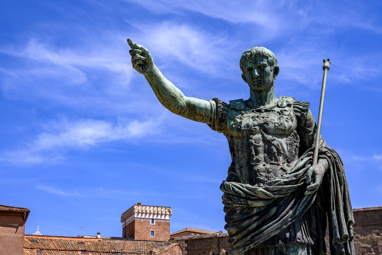 Majestic bronze statue of Julius Caesar in Rome, Italy, with historic architecture backdrop