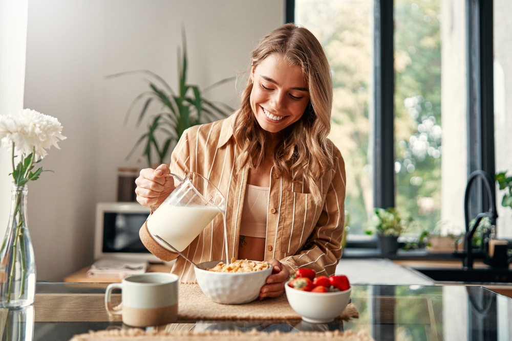 woman pouring milk