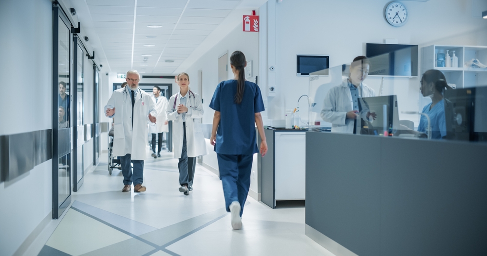 hospital staff walking down corridor