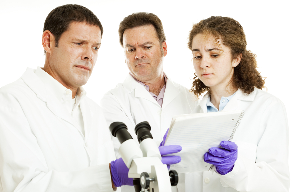 Scientists or doctors in lab reading strange test results.