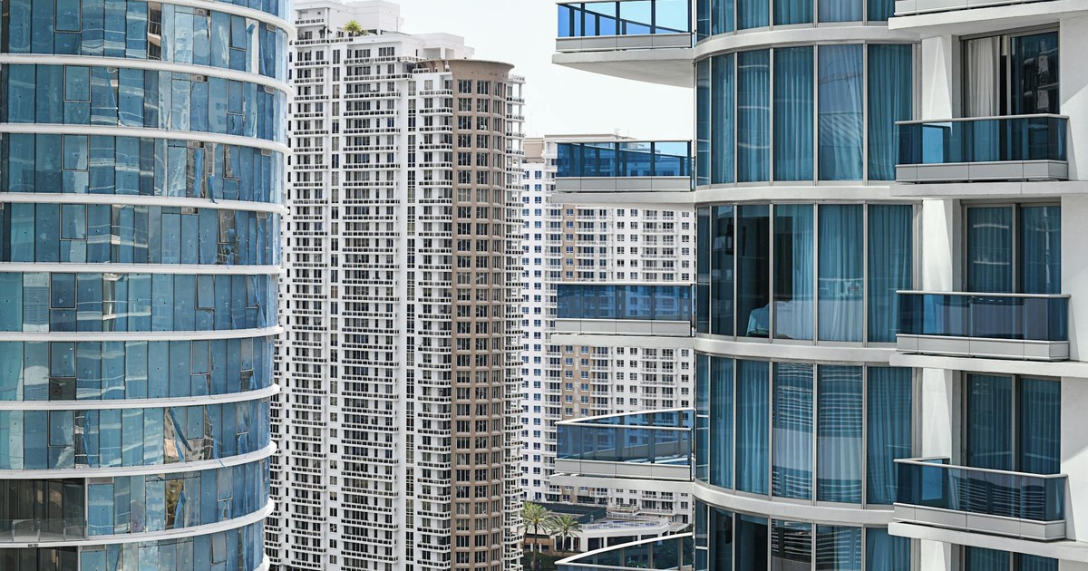 Contemporary cityscape showcasing modern high-rise buildings with glass balconies and facades.