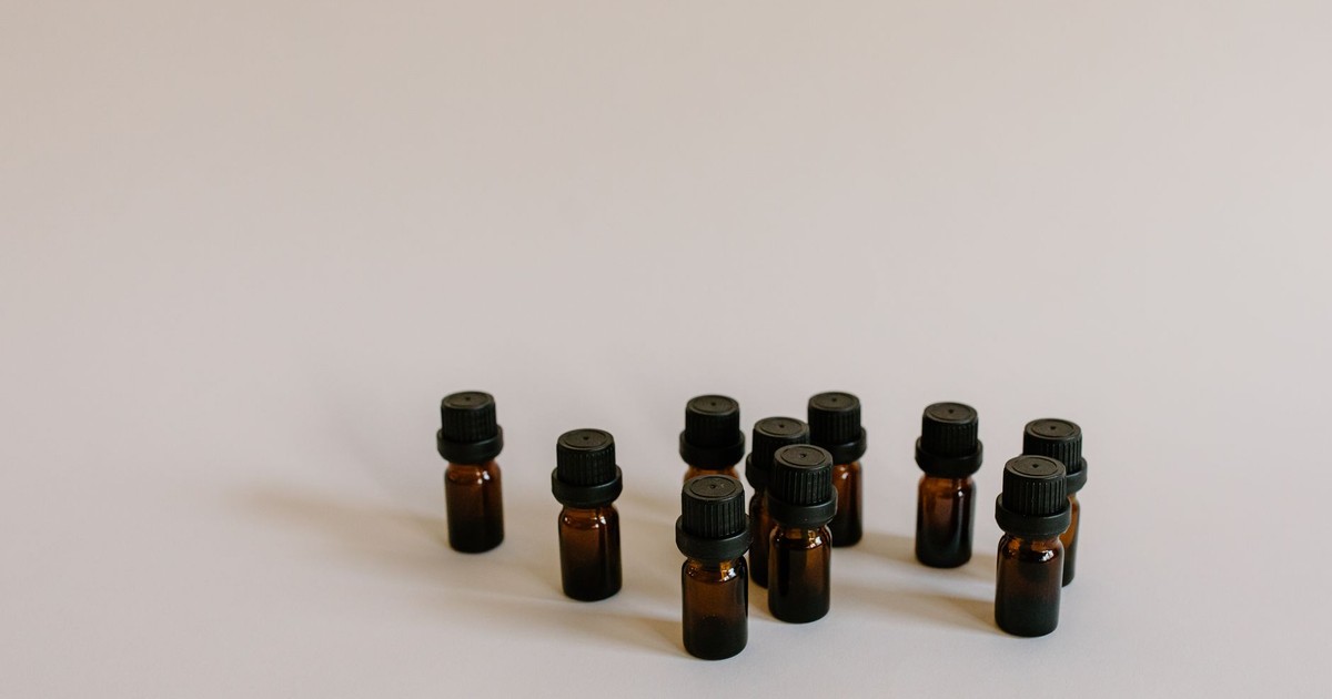 A minimalist still life of brown glass bottles for aromatherapy or essential oils with copy space.