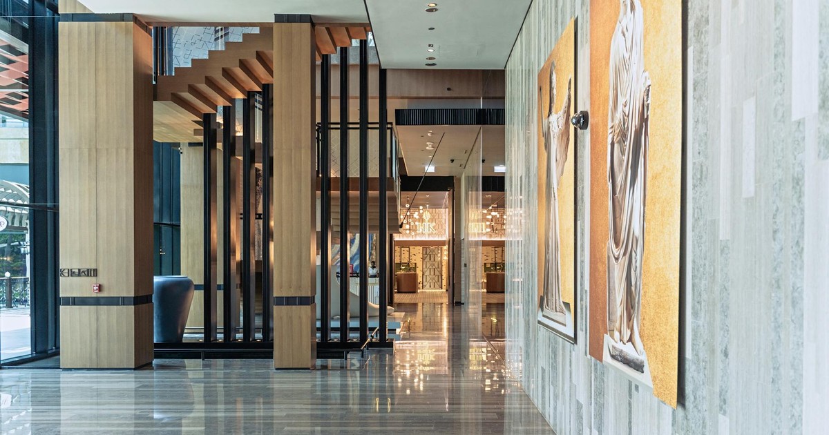 Spacious and modern hotel lobby in Dubai with elegant decor and marble floors.