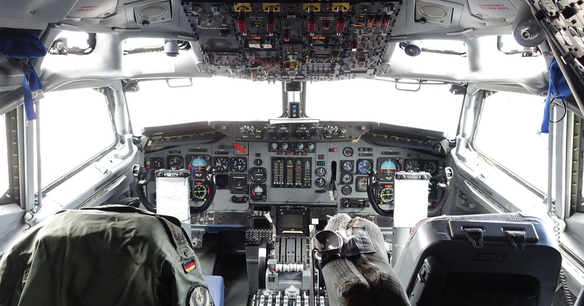 Explore the intricate aircraft cockpit, showcasing aviation controls and design.