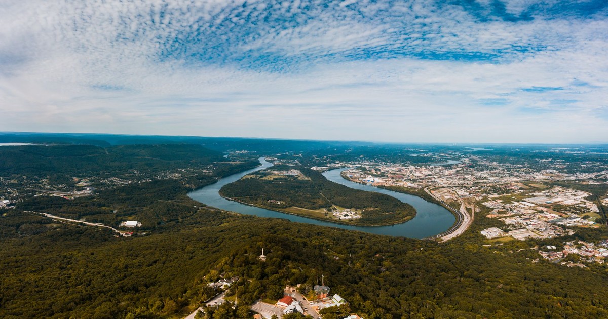 Breathtaking scenery of Tennessee River flowing near Moccasin Bend Archaeological District against cloudy blue sky