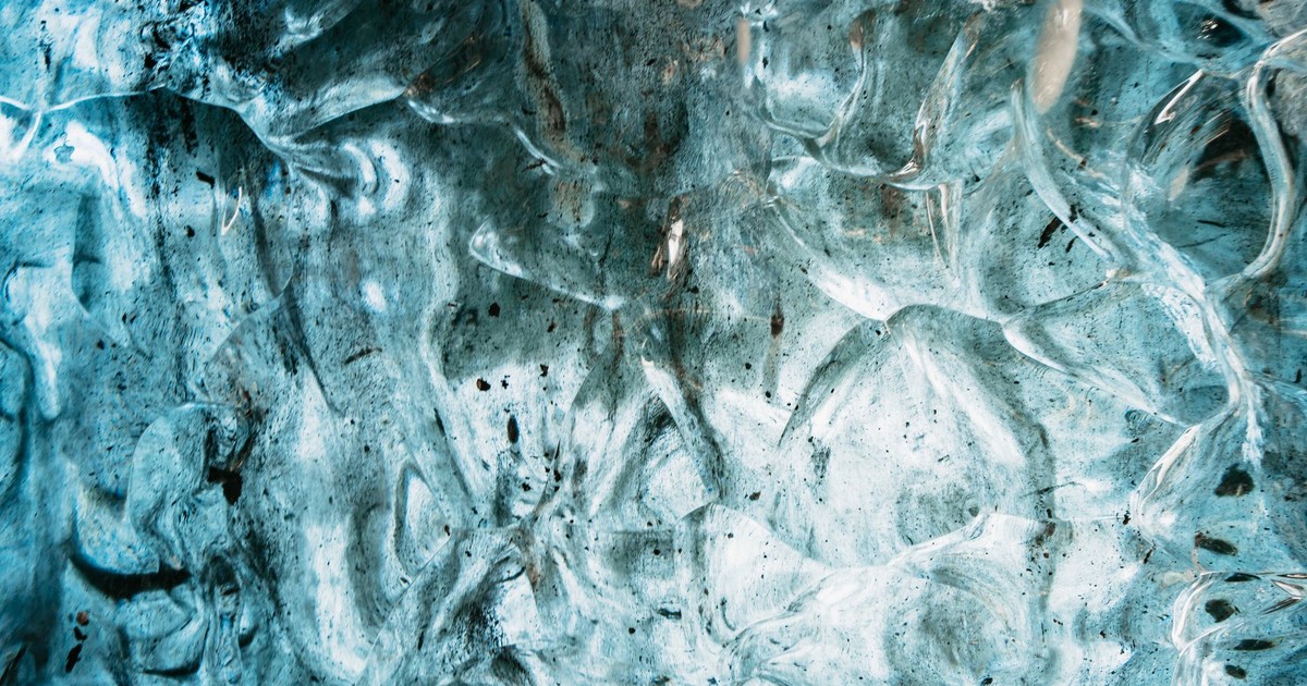 Stunning close-up of intricate ice formations in Iceland's caves, showcasing nature's frozen art.