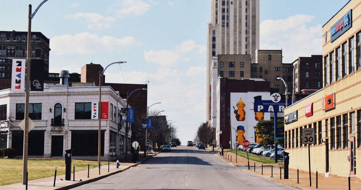 A vibrant city street in St. Louis, showcasing historic architecture and urban life.