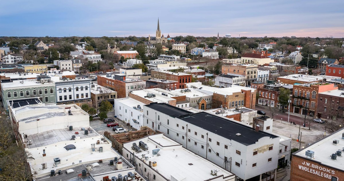 Aerial view of historic downtown Wilmington, NC showcasing urban architecture and church spires.