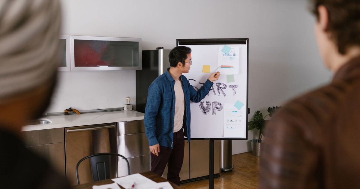 Team members discussing project ideas in a modern office setting.