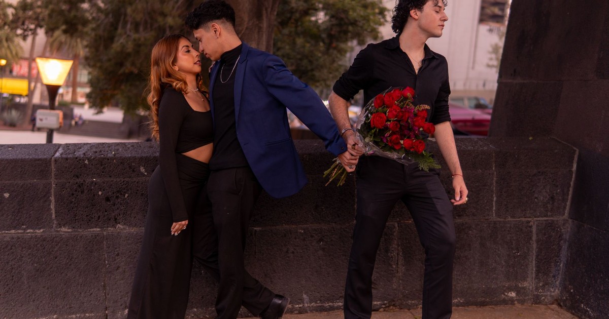 Three people caught in emotional love triangle outdoors at sunset.