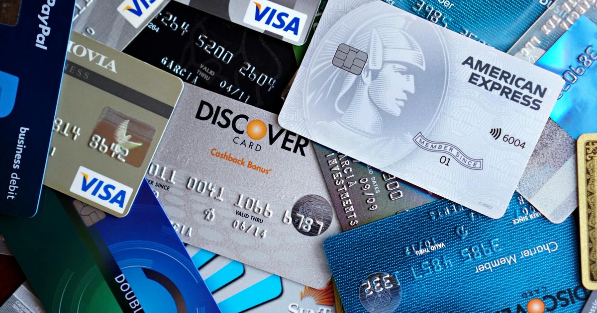 Close-up image of various credit cards including Visa, Mastercard, and American Express.