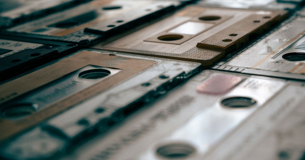 Close-up of a collection of vintage cassette tapes, showcasing nostalgia.