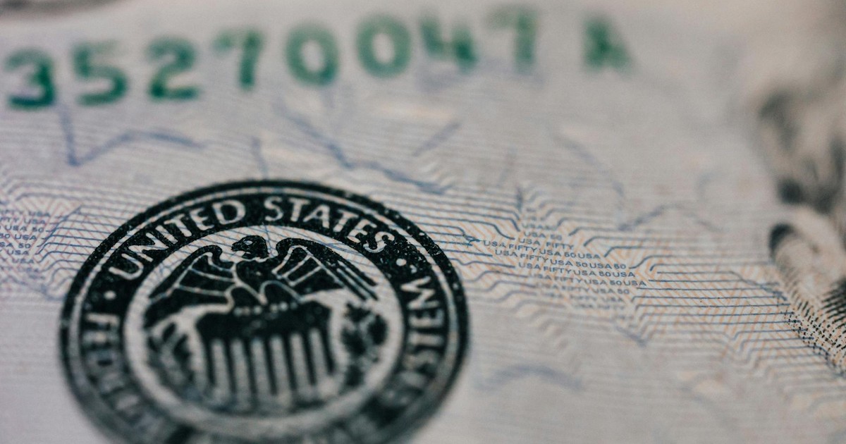 From above closeup of national symbol of USA paper money representing official seal with eagle with olive oil and arrow sitting on shield