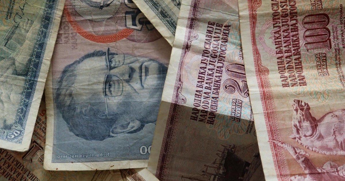 A close-up photo of diverse vintage banknotes, showcasing historical currency from different countries.